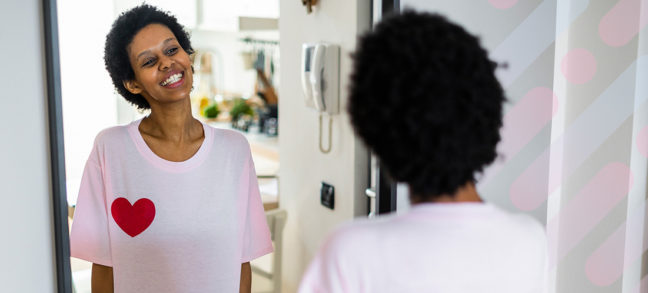 Woman smiling into mirror